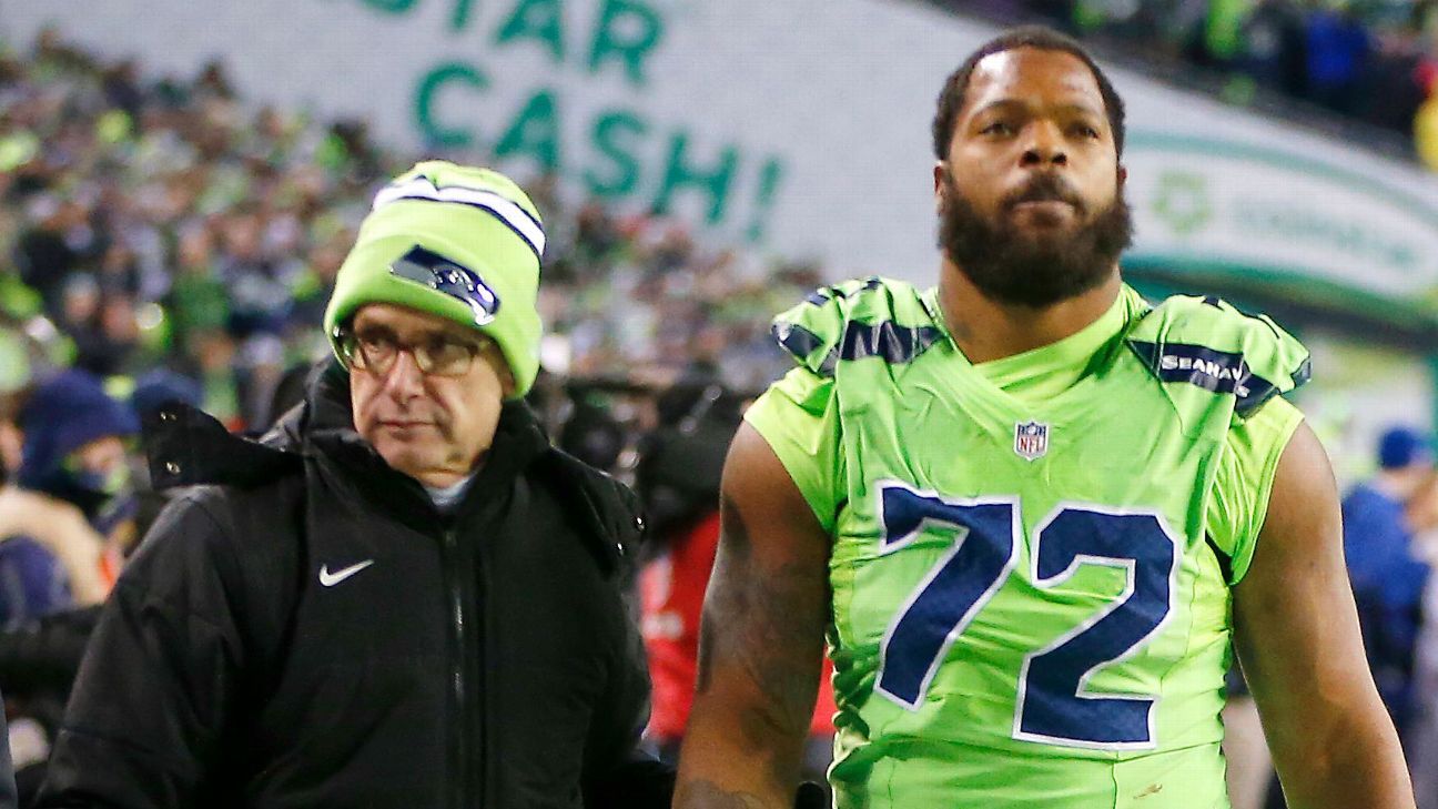 Michael Bennett of Seattle Seahawks exits against Los Angeles Rams with possible concussions
