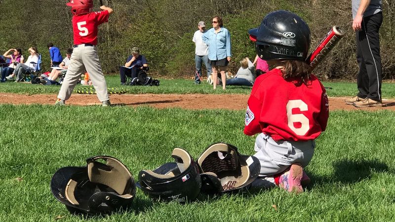 Seth Wickersham's daughter, Maddie, waits on deck in her first baseball game.