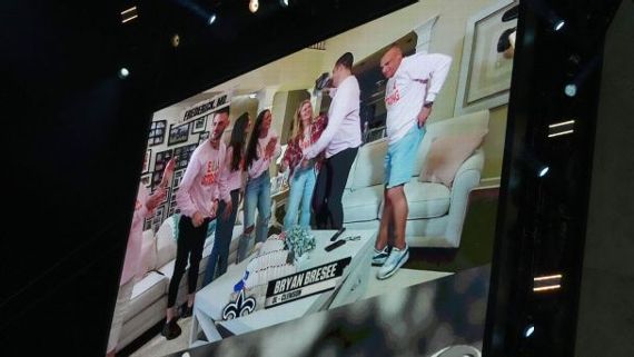 A picture of the big screen at the NFL draft in Kansas City, Missouri, shows Bryan Bresee hugging his family in their 