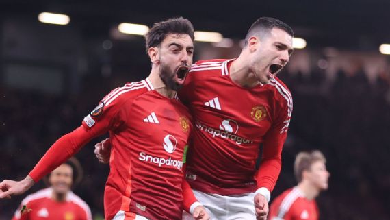Manchester United players on the field during a europa League match