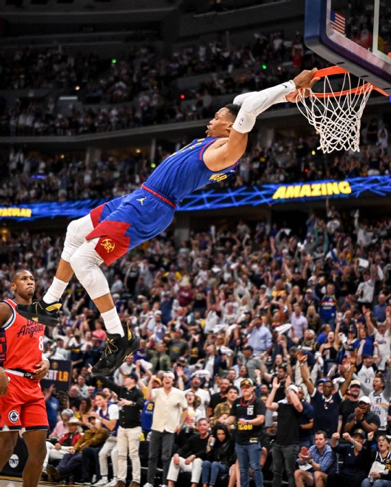 Russell Westbrook hangs on the rim