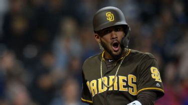 The San Diego Union-Tribune - The Padres' Manny Machado, left, Fernando  Tatis Jr., center, and Eric Hosmer, wear the Padres new brown uniforms  after they stood on stage to show fans during