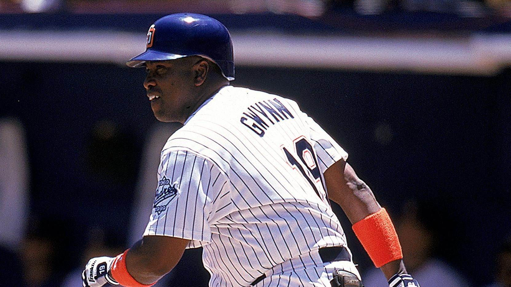 Hall of Fame ball player Tony Gwynn signs a 1998 jersey during