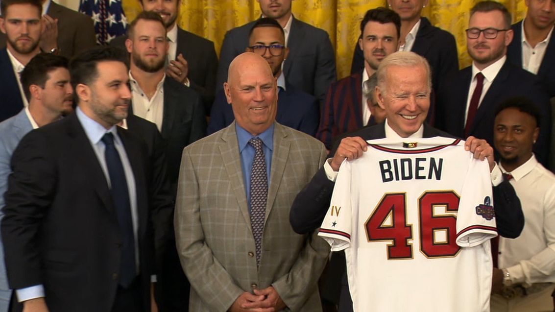 A football with President Joe Biden's name on it, a jersey and a