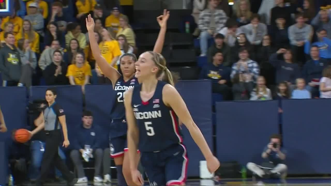 Paige Bueckers sinks half-court shot at the horn