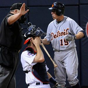 American League's Brandon Inge of the Detroit Tigers flips his bat