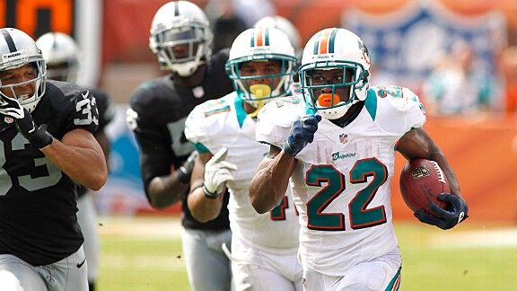 Miami Dolphins' running back Reggie Bush (22) runs with the ball