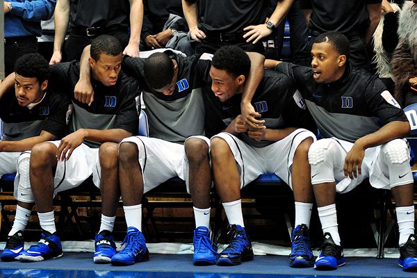 Duke forward Jabari Parker and Kansas guard Andrew Wiggins look ...