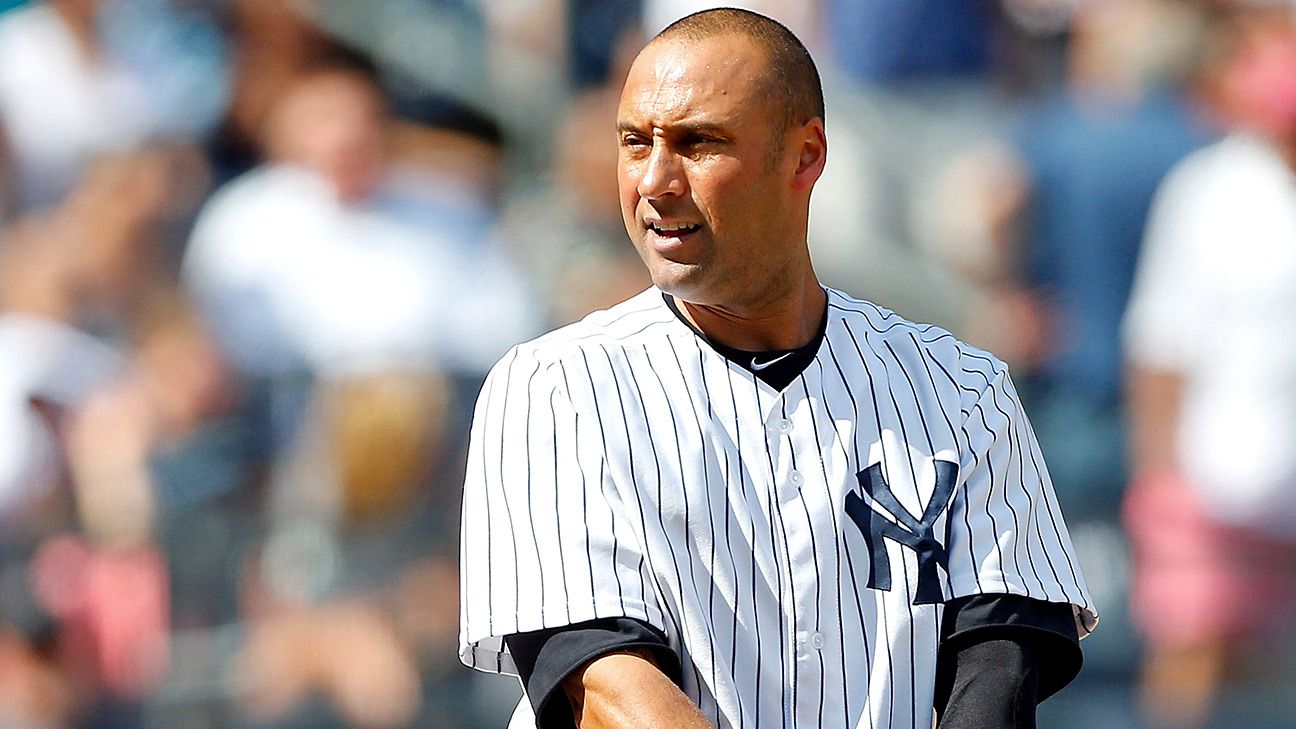 Yankees captain, Derek Jeter, waves to the fans at Fenway Park prior to  playing the last game of his career