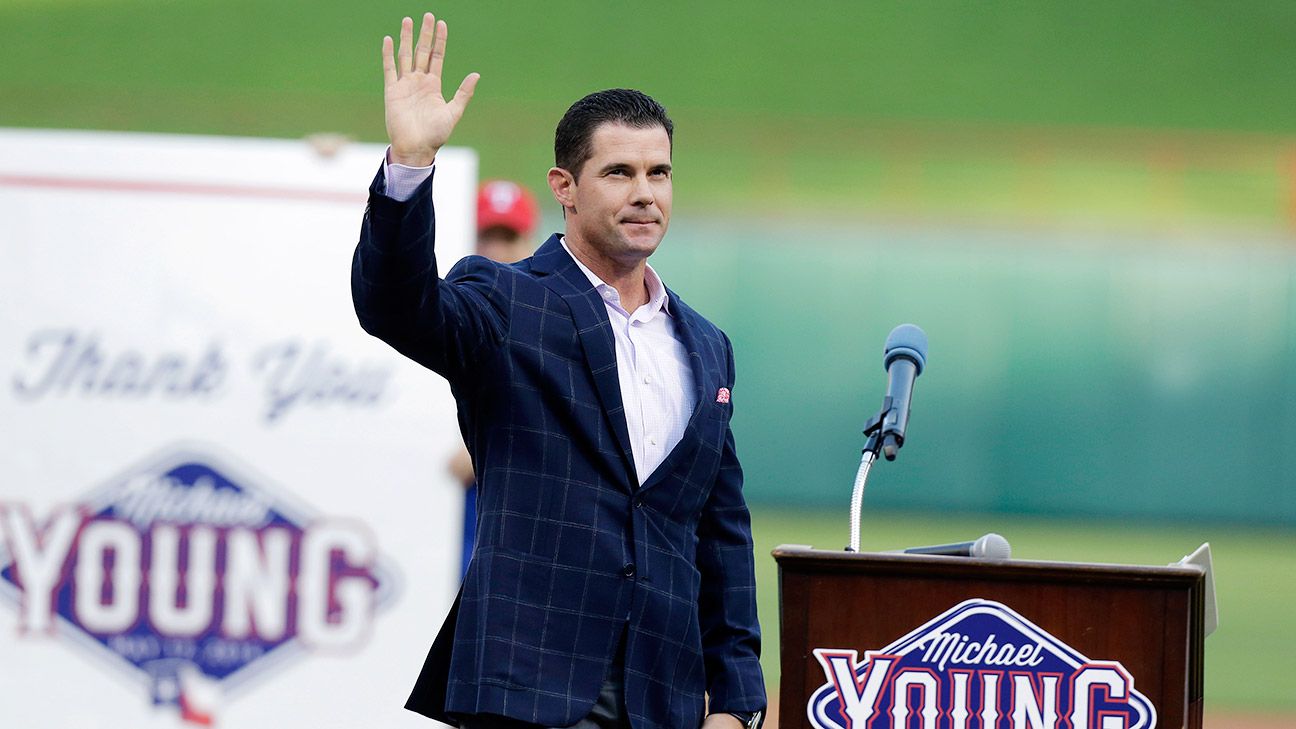 Former Texas Rangers star Michael Young is greeted by his son