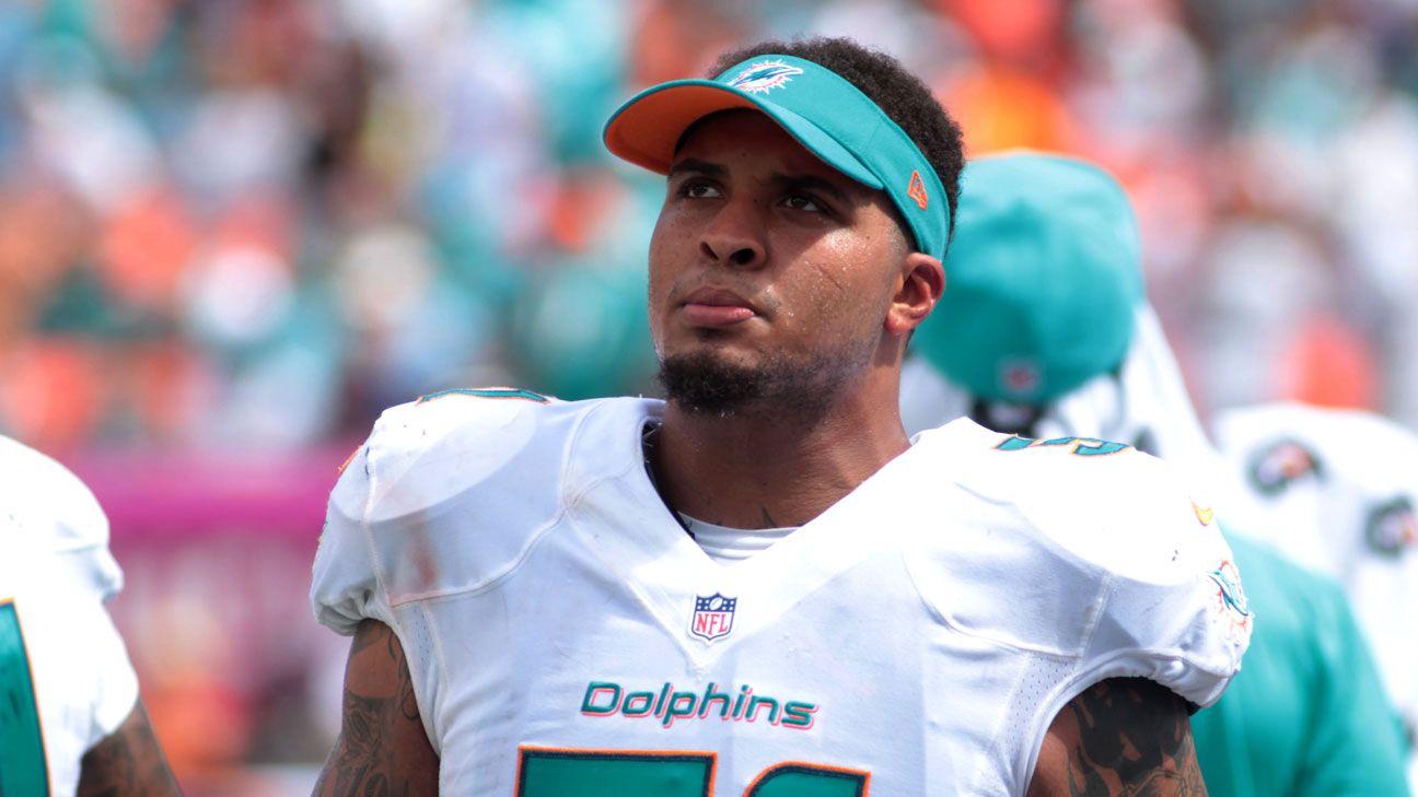 Center Mike Pouncey of the Miami Dolphins signals at the line of