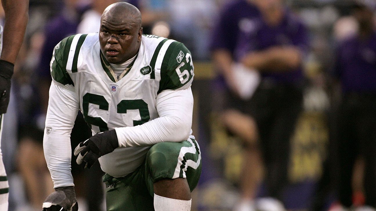 New York Jets Dewayne Robertson leaps in the air after a 8 yard