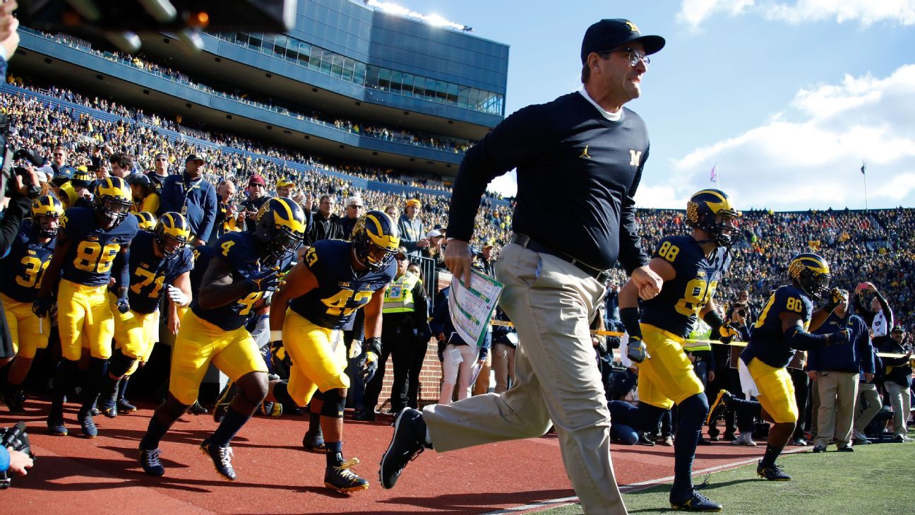 Jim Harbaugh takes on Comerica Park, khakis and all