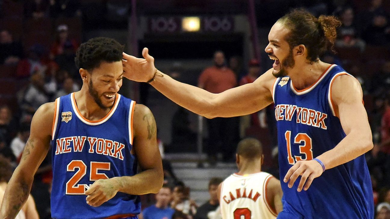 Chicago Bulls' Derrick Rose talks to teammates as he controls the ball  during the third quarter of an NBA basketball game against the New Jersey  Nets in Chicago, Wednesday, April 13, 2011.