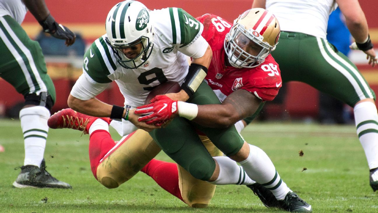 Denver Broncos quarterback Russell Wilson (3) is tackled by Indianapolis  Colts defensive tackle DeForest Buckner (99)