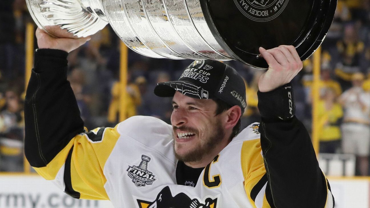 Derian Hatcher of the Dallas Stars celebrates with the Stanley Cup