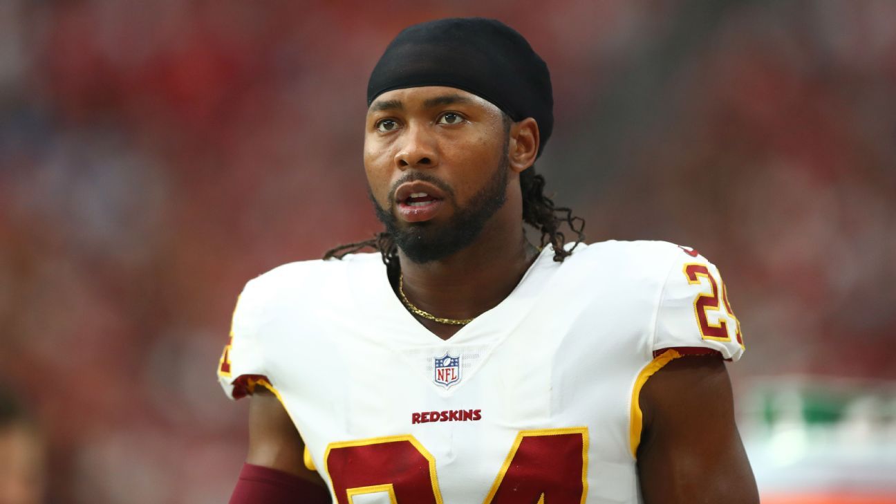 Washington Redskins' newly signed cornerback Josh Norman listens