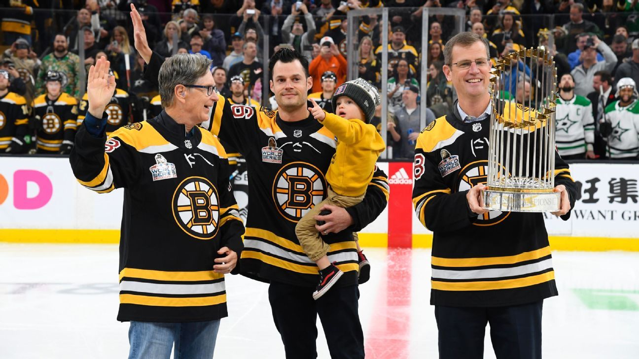 Boston Red Sox bring World Series trophy to Boston Bruins game - ESPN