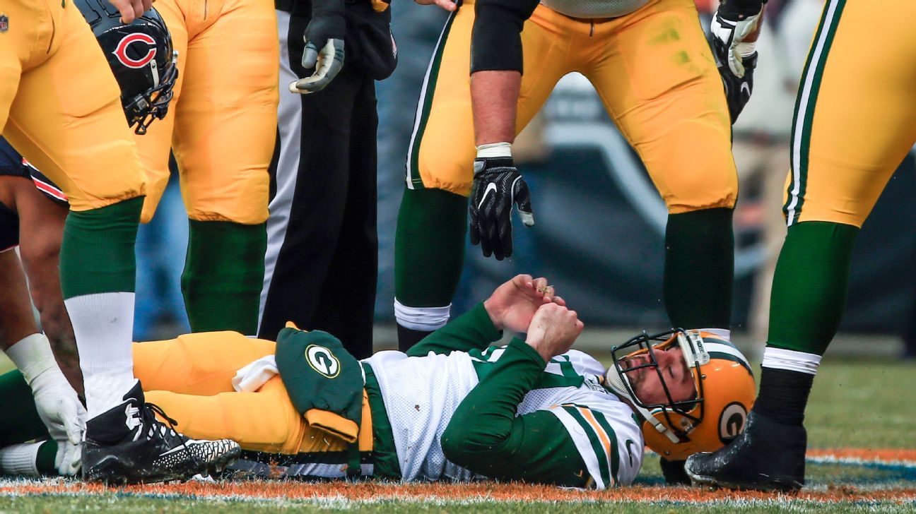 Rodgers breaks record, Packers grab four interceptions in