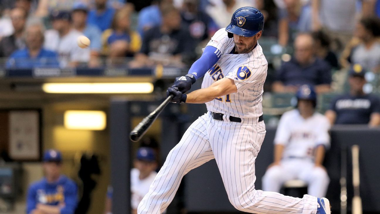 Brewers Travis Shaw is greeted by Christian Yelich at home plate