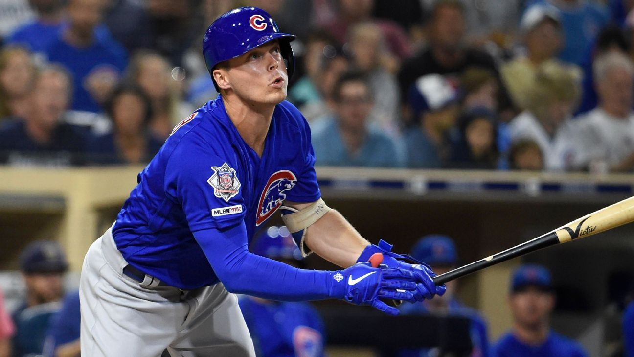 Nico Hoerner #2 of the Chicago Cubs tags a player from St. Louis