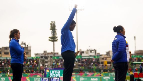With fist raised, Olympic track and field star Gwen Berry determined to make a difference