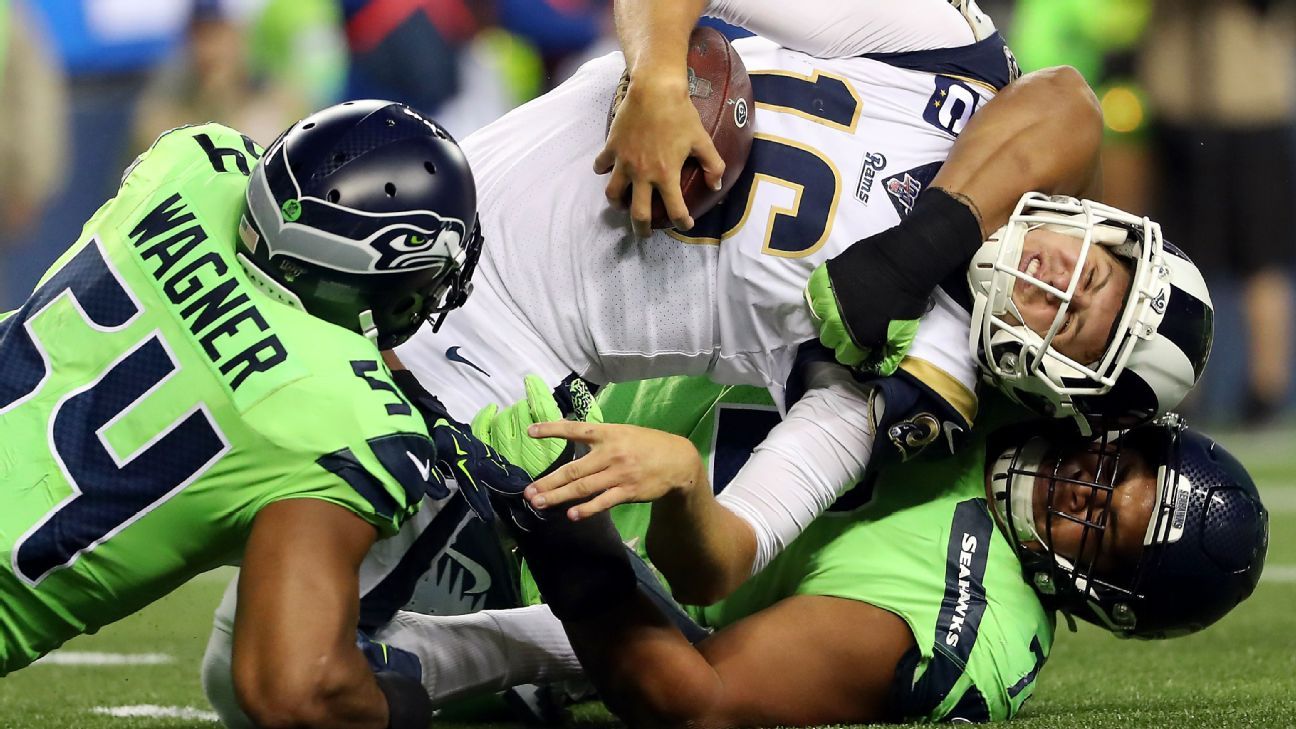 Seattle Seahawks defensive tackle Al Woods (99) rushes in against