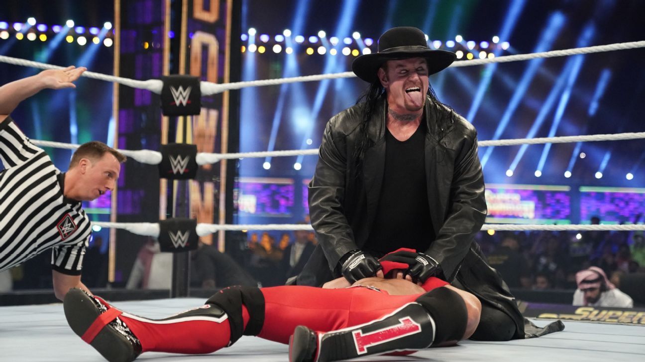 WWE's Undertaker talks Cowboys, Longhorns fandom; what it meant to be part  of Salute to Service game