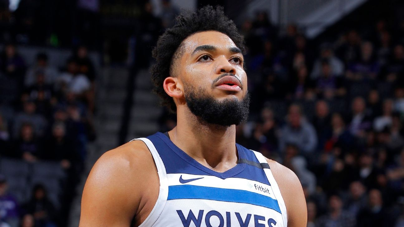 Minnesota Timberwolves' Karl-Anthony Towns joins six teammates in health and saf..