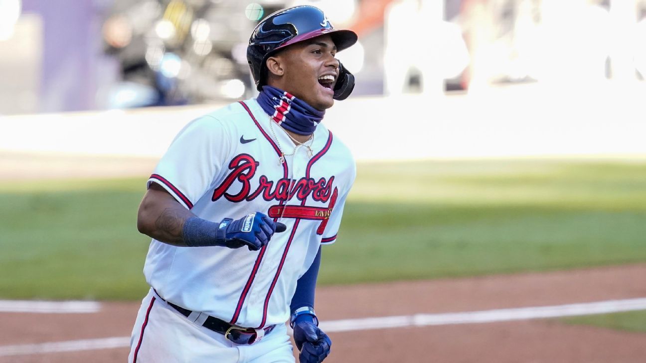 From left to right, Braves outfielders Adam Duvall, Cristian Pache