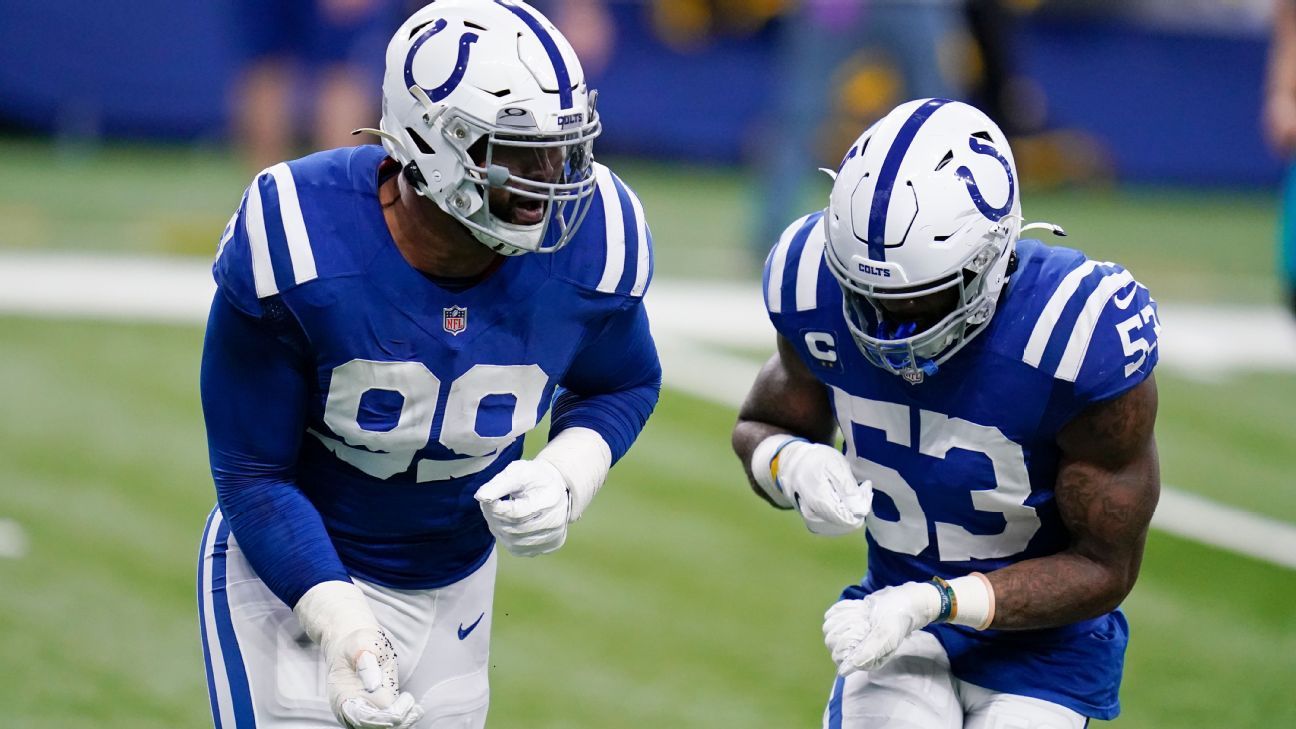 Denver Broncos quarterback Russell Wilson (3) is tackled by Indianapolis  Colts defensive tackle DeForest Buckner (99)