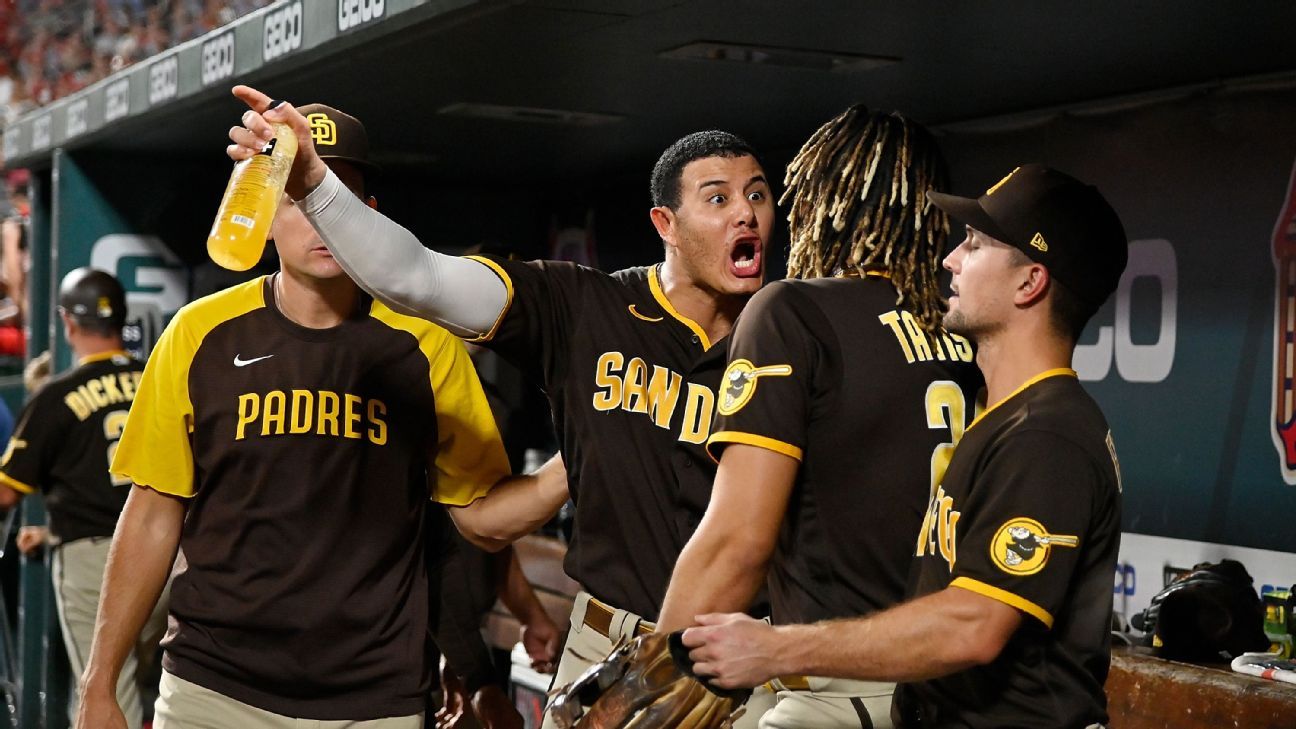 San Diego Padres' Manny Machado screams at Fernando Tatis Jr. in