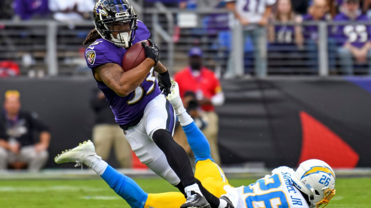 Baltimore Ravens running back Devonta Freeman runs the ball against the  Detroit Lions in the first half of an NFL football game in Detroit, Sunday,  Sept. 26, 2021. (AP Photo/Tony Ding Stock