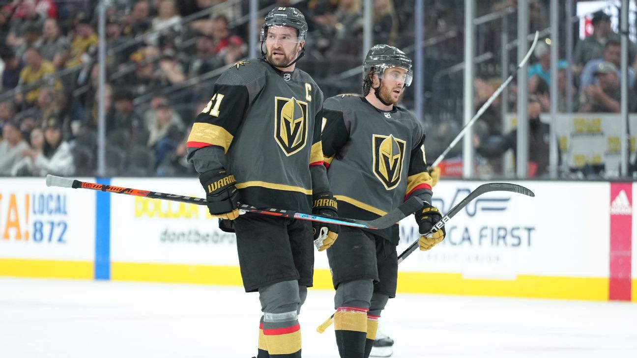 Vegas Golden Knights' Nick Cousins, left, gets past Calgary Flames