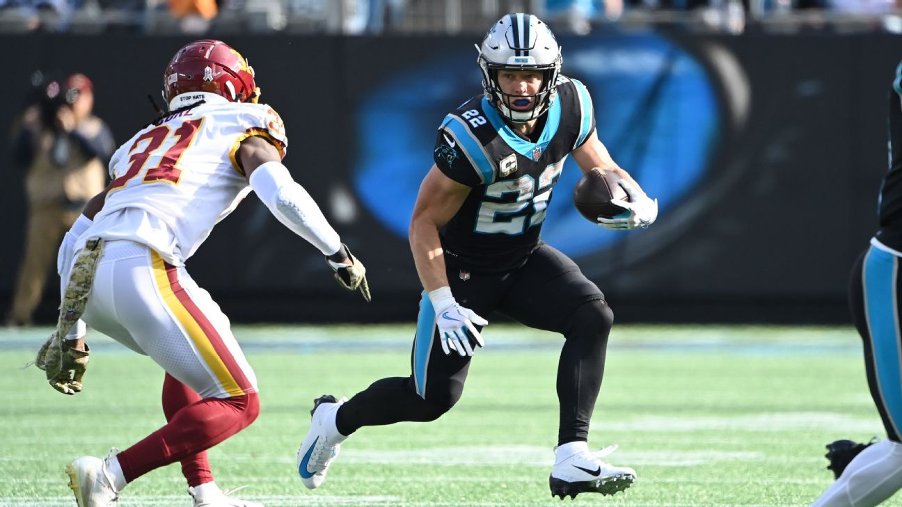 Carolina Panthers running back Christian McCaffrey (22) is tackled by Las  Vegas Raiders safety …