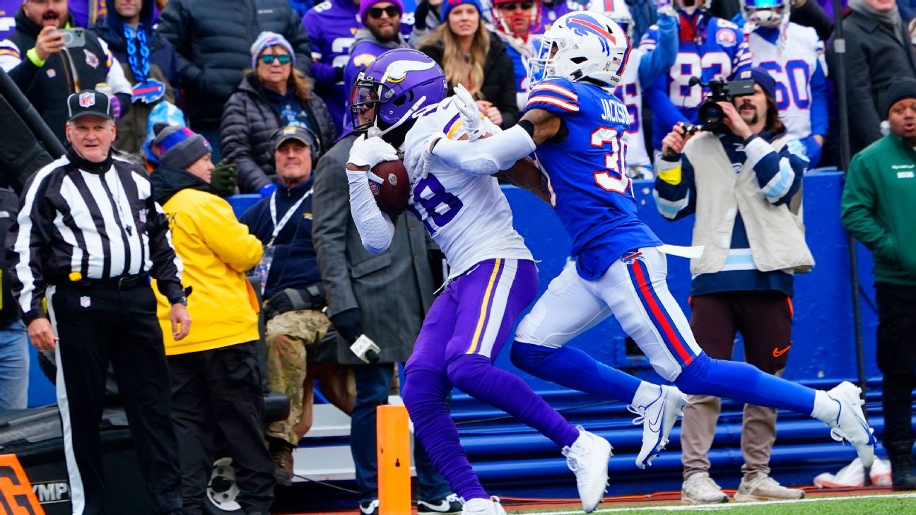 Minnesota Vikings wide receiver Justin Jefferson (18) makes an incredible  catch in front of Buffalo Bills safety Cam Lewis (39) during the second  half of an NFL football game in Orchard Park