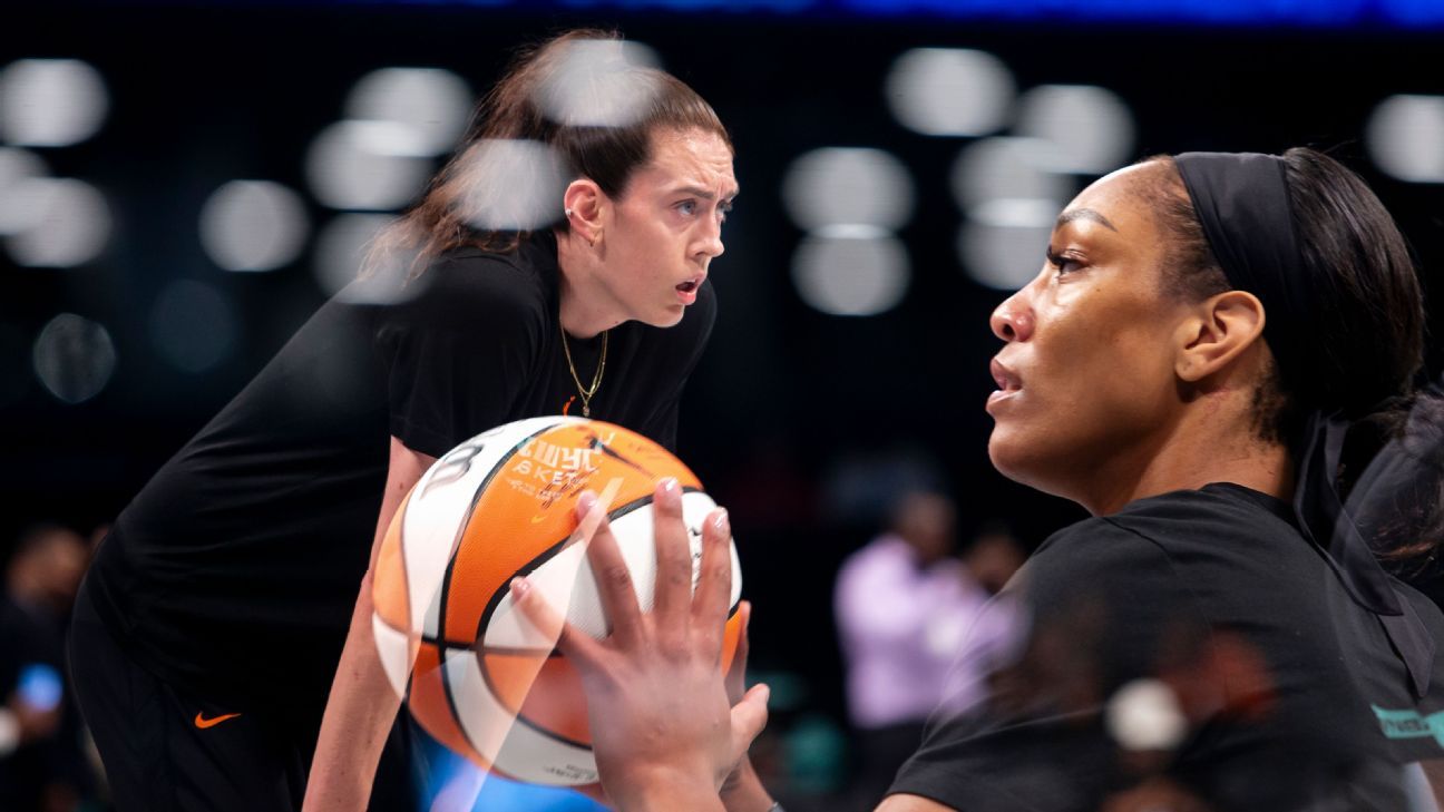 Forward A'ja Wilson reacts with teammate Forward Candace Parker of