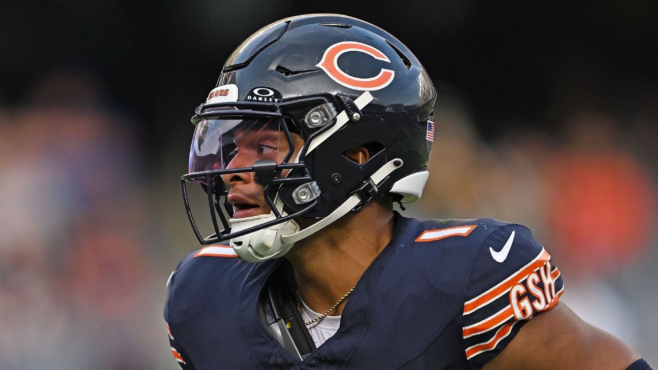 Darnell Mooney of the Chicago Bears reacts after catching a pass for in  2023