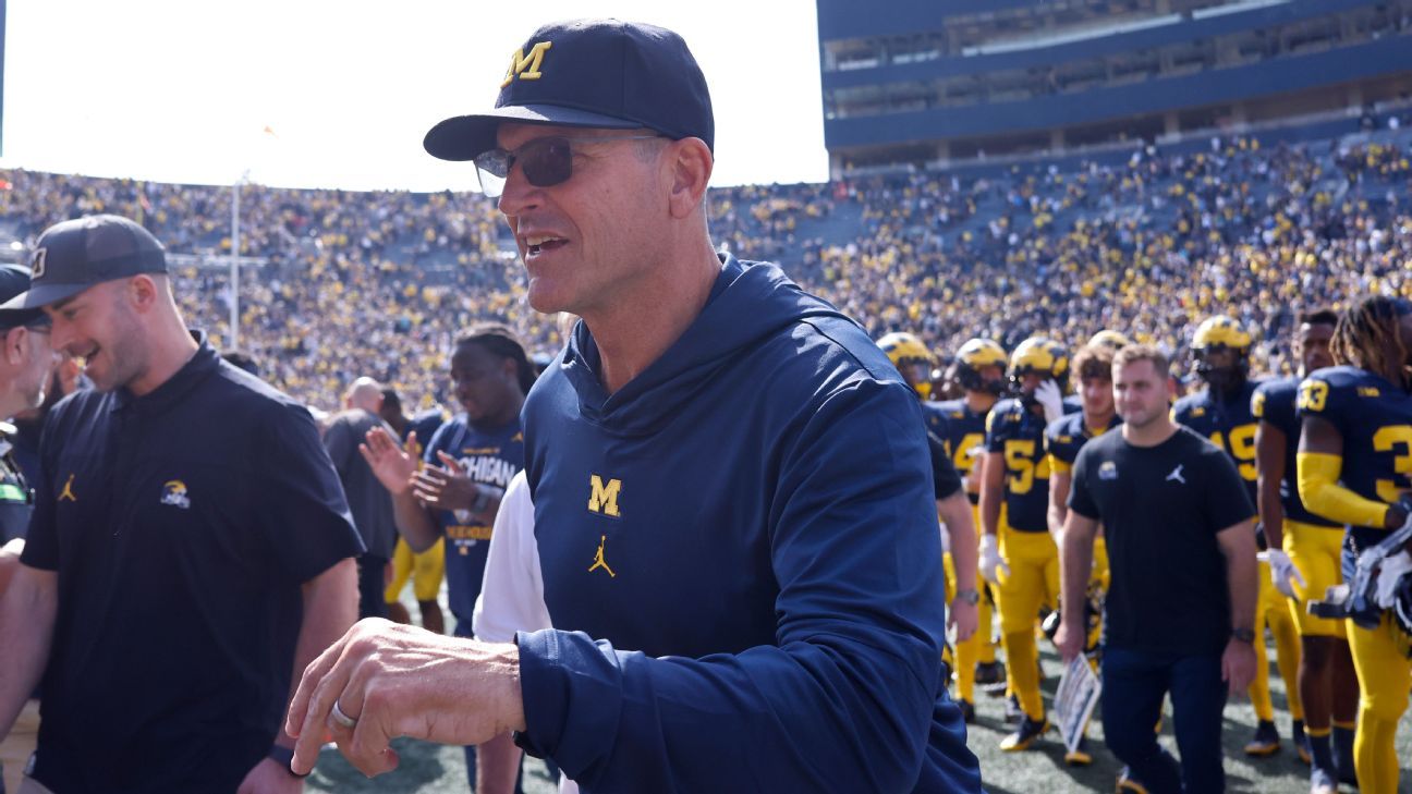 Harbaugh back after suspension: 'Super happy'