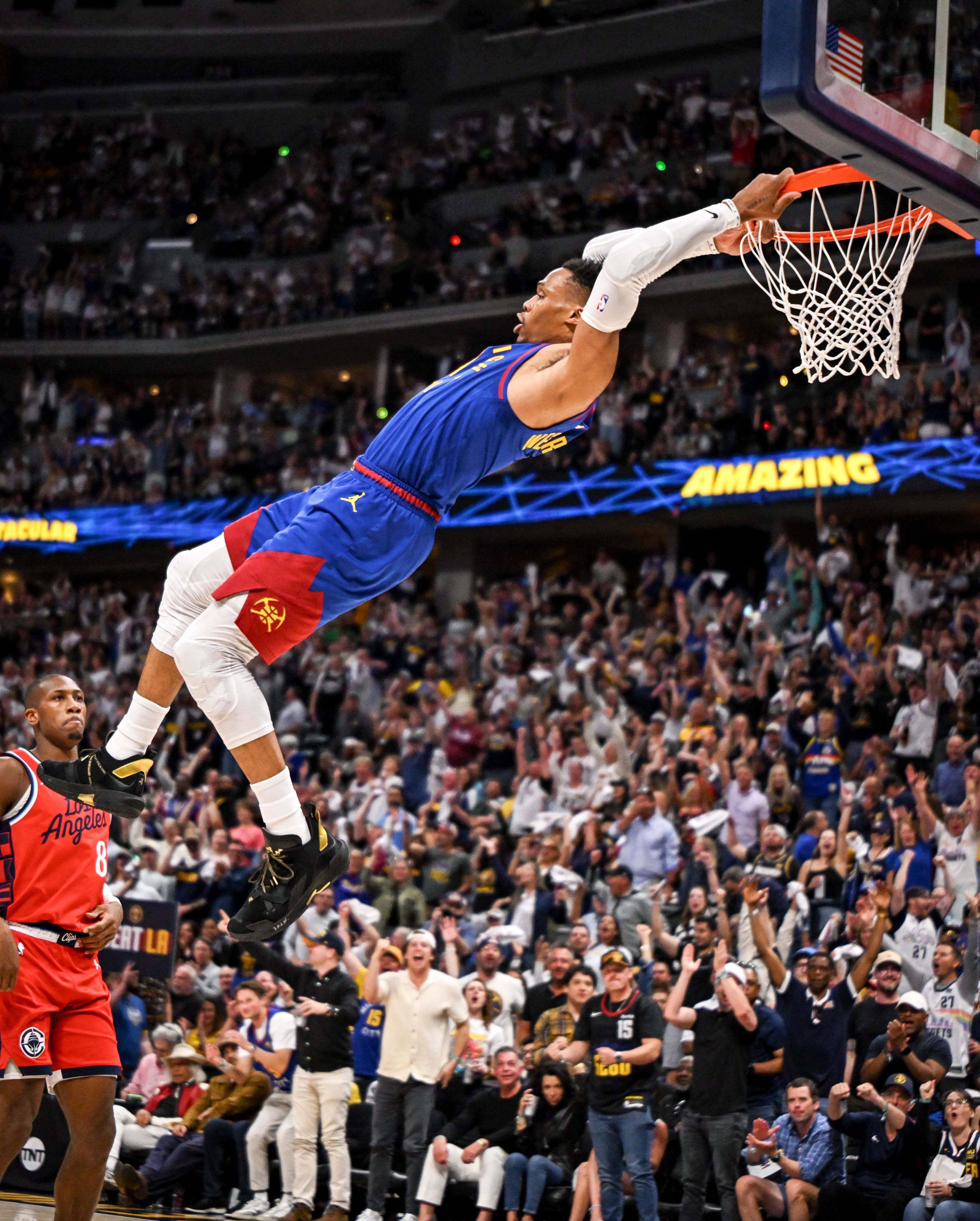 Russell Westbrook hanging on rim