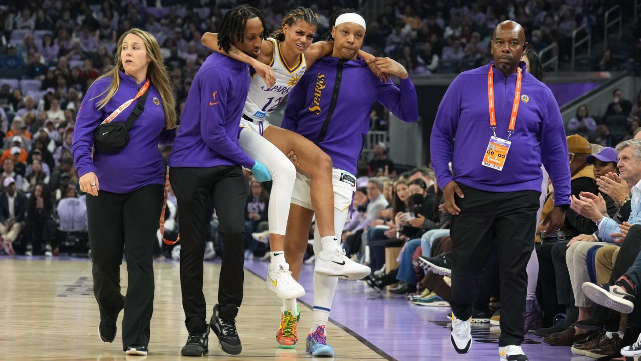 Sparks' Burrell injured, carried off court in opener