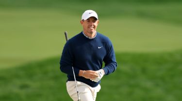 rory McIlroy ‌on the course, focusing on his next shot.