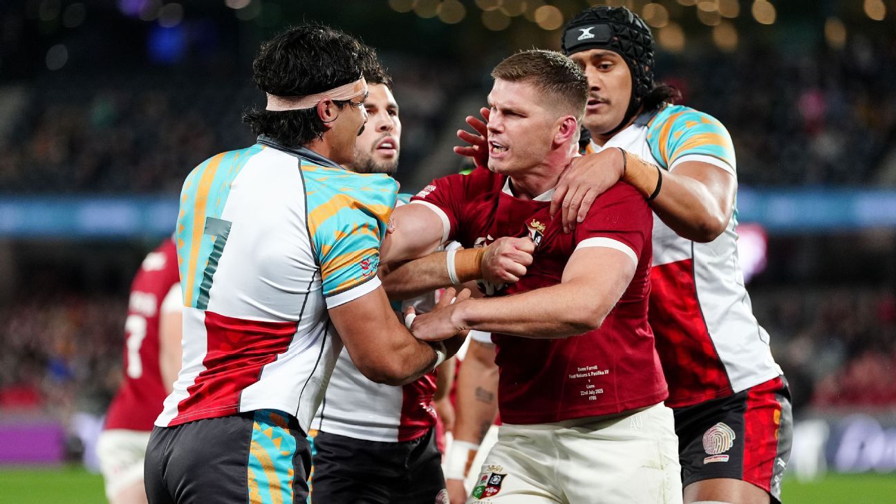 Lions captain Owen Farrell [C] grapples with First Nations-Pasifika players Charlie Gamble and Tuiana Taii Tualima during the tour game in Melbourne, July 22, 2025