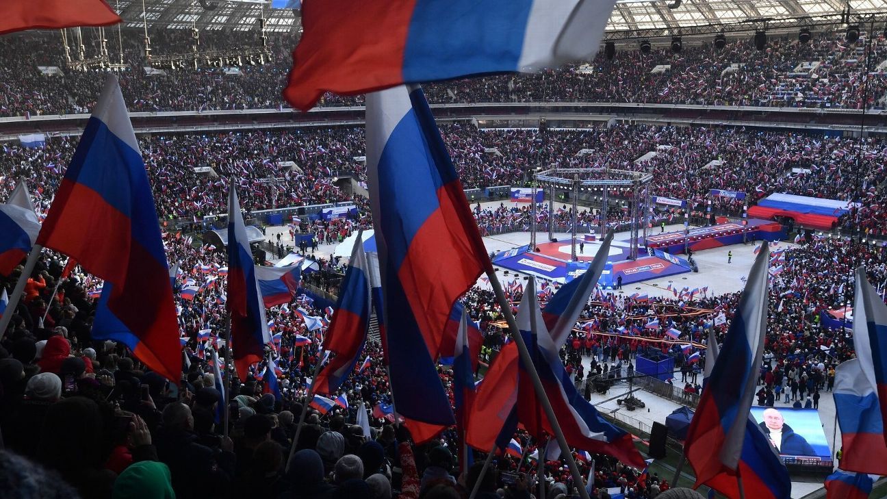 Olimpiade Rusia menghadapi reaksi setelah menghadiri rapat umum Vladimir Putin