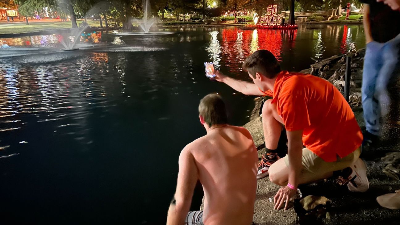 The late-night dive to rescue the Bedlam goalposts after Oklahoma State's historic win